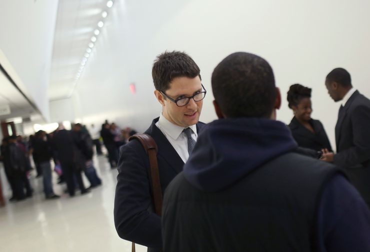 Scott Levy, of the Bronx Defenders, with a client who was to be arraigned in 2012 at the Bronx County Hall of Justice in New York after an arrest for marijuana possession. 