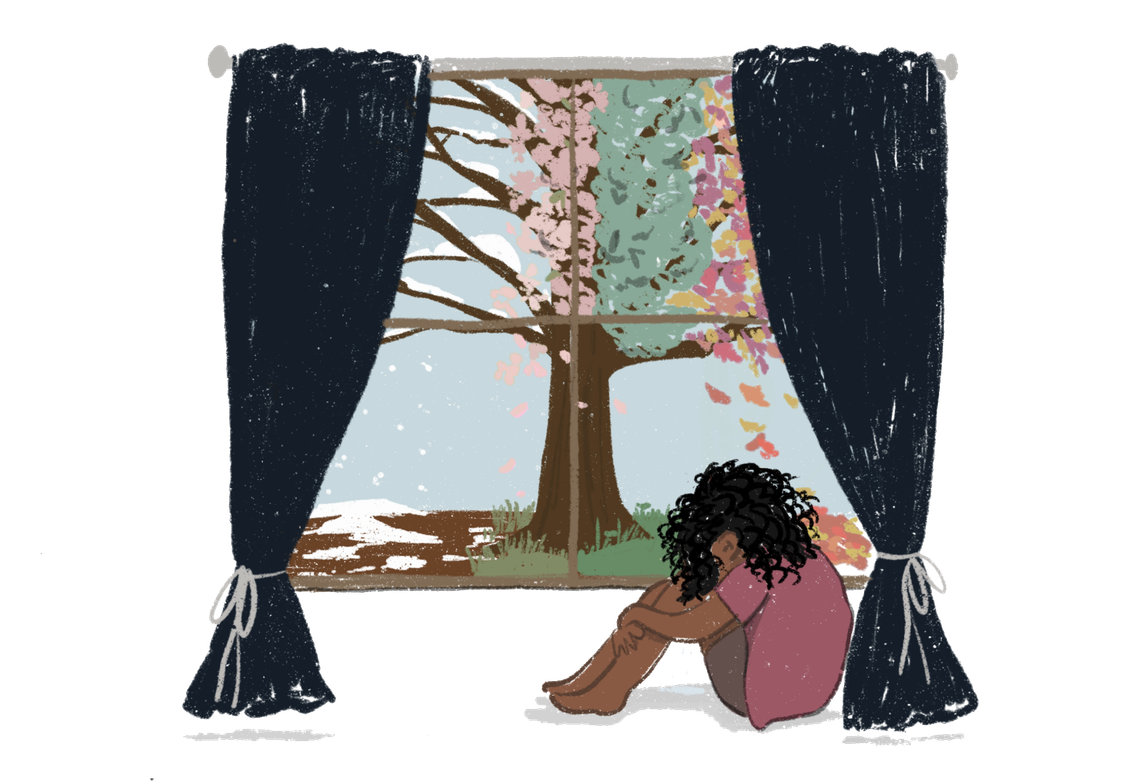 An illustration shows a brown person sitting on the floor with their head on their knees. They sit by a window with curtains. A tree shows a change of seasons, from winter to spring, outside the window. 