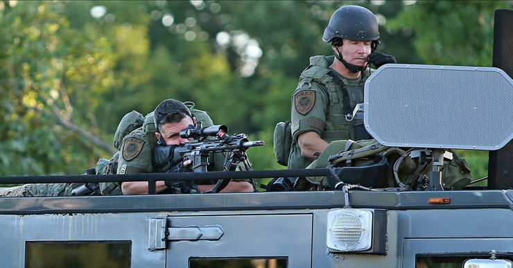 Heavily-armed police deployed during protests over the killing of Michael Brown in Ferguson, Mo., in 2014.