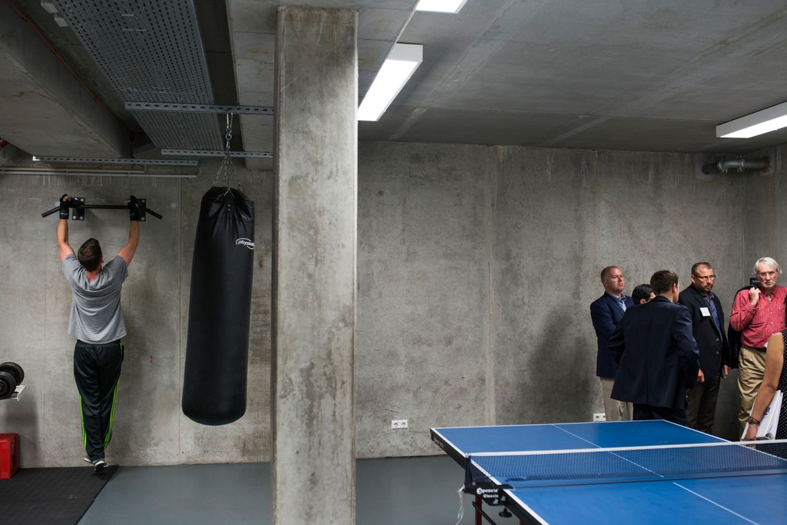 A German inmate and members of the American delegation in the exercise room of a Berlin prison.