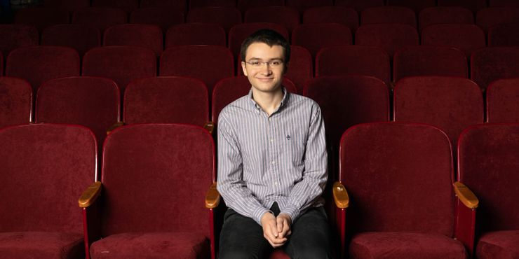 Spencer Cliche in the auditorium of Massachusetts’ Amherst Regional High School, where seats were reupholstered using prison labor.