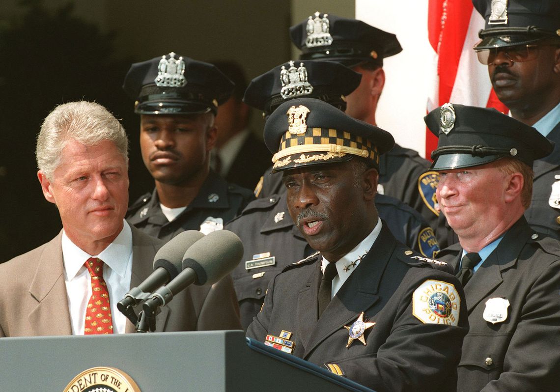 President Bill Clinton approved federal funding to hire more local police officers across the country during the 1990s. He attended a ceremony at the White House with then-Chicago Police Superintendent Terry Hillard in 1998. 