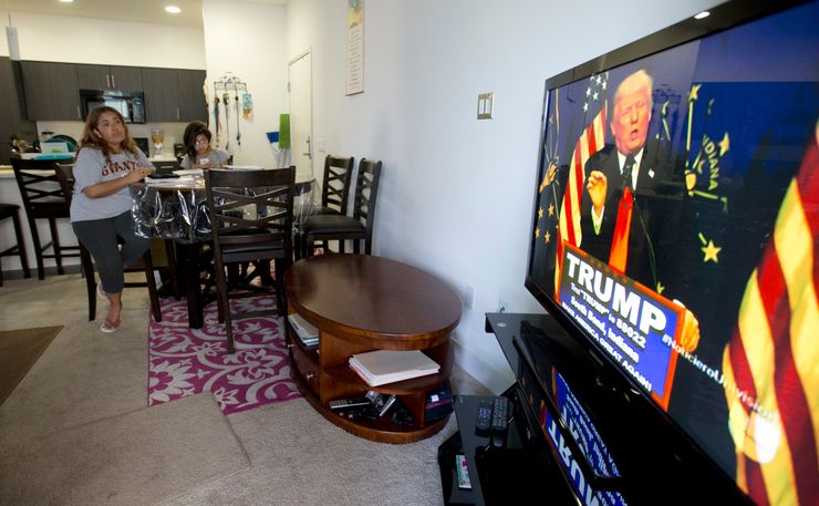 Maribel Solache watches television news in Spanish in her apartment in San Marcos, Calif. in May 2016.