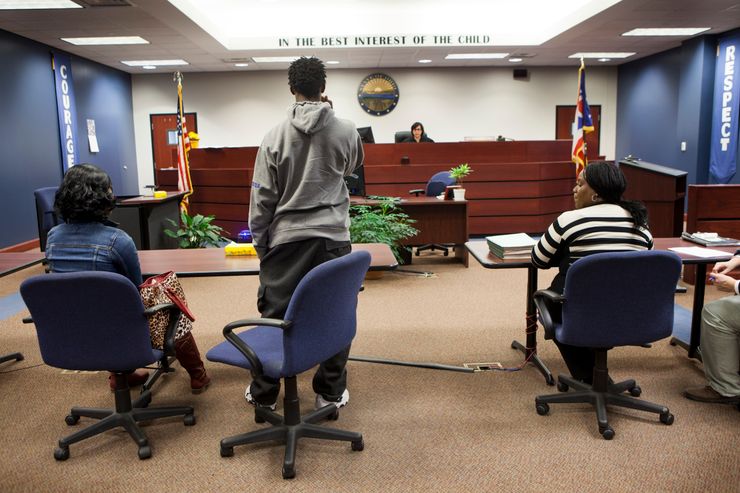 Judge Denise Navarre Cubbon in her courtroom with a juvenile offender in 2015 at the Lucas County Juvenile Court in Toledo, Ohio.