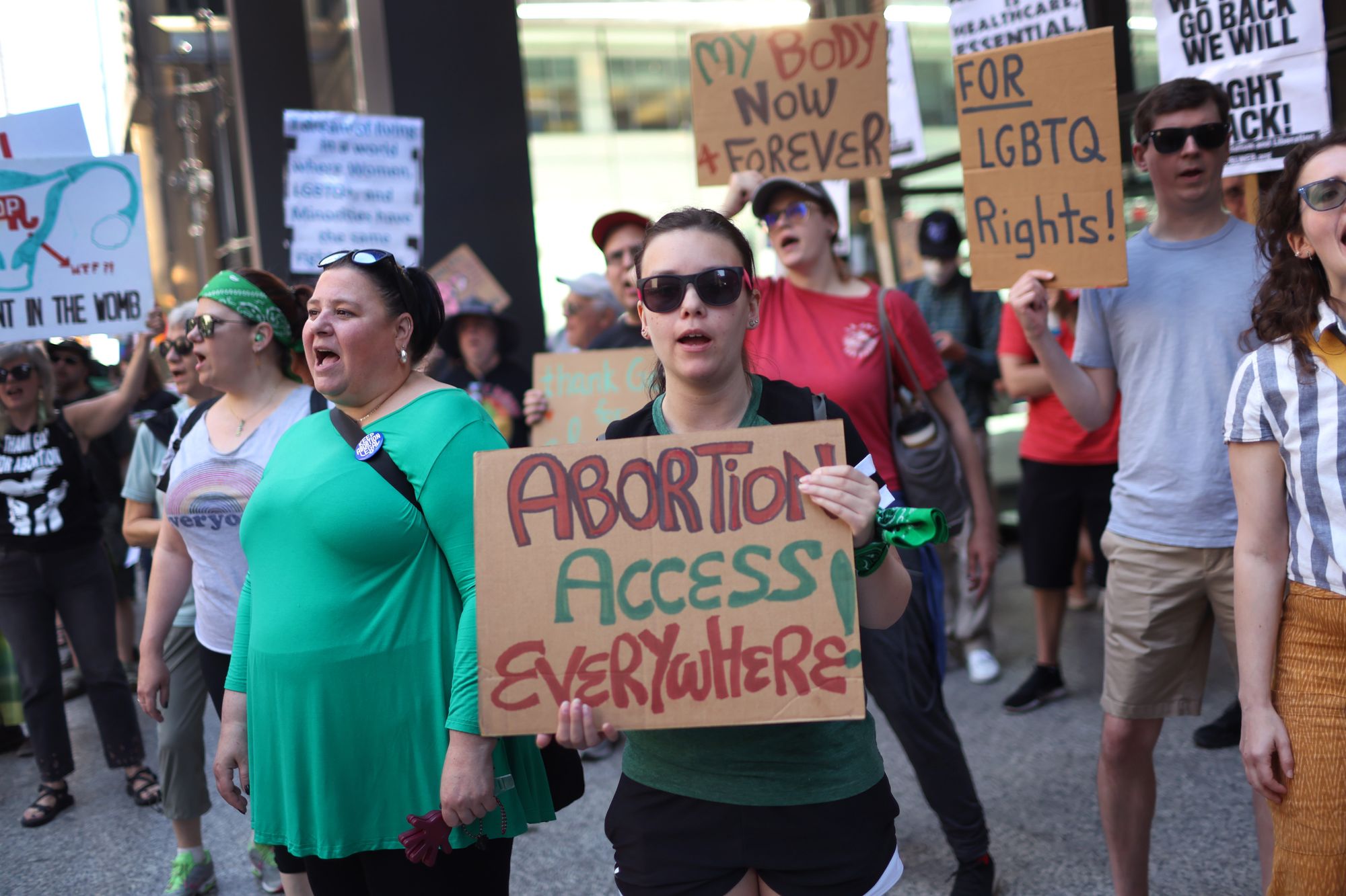 Protesters held signs at a protest in Chicago, some of which read: "Abortion Access Everywhere!", and "My Body Now and Forever".  