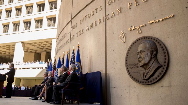 FBI Director Chris Wray, left, speaks at his installation ceremony at the FBI Building, in Washington in September.