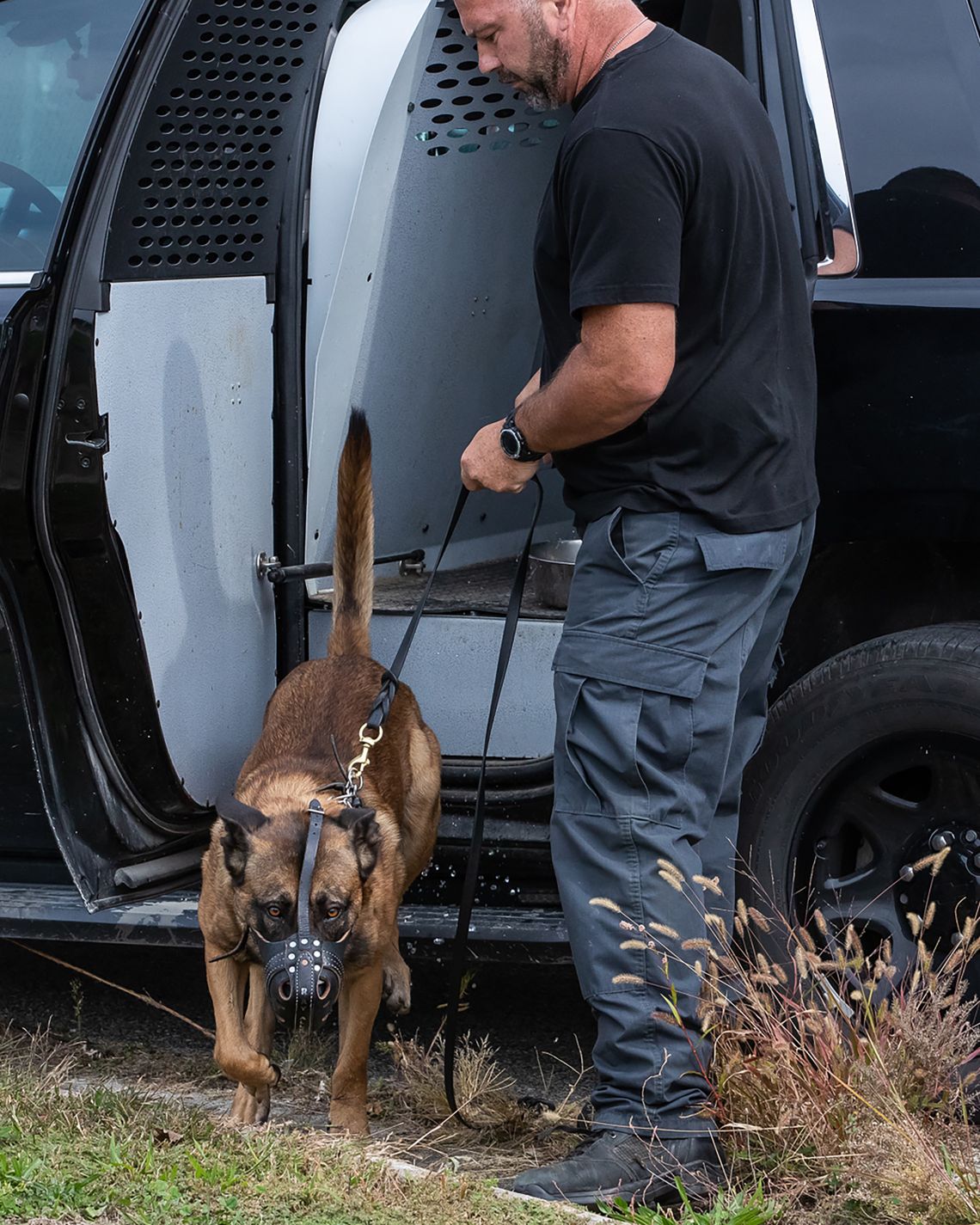 Officer Ronald Hilburn, with the police department in Nixa, Missouri, prepares to train with his dog at Vohne Liche Kennels in Indiana in September.