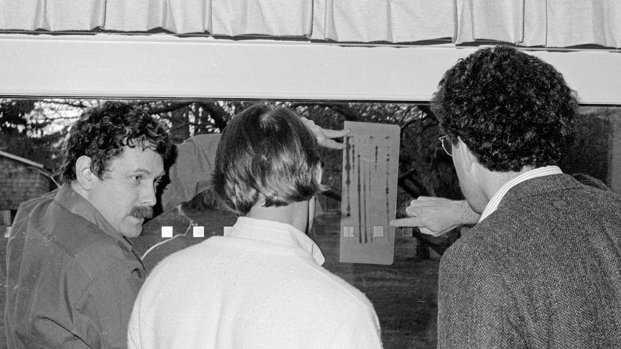 Eric Lander, left, who was just nominated to be President Biden's science adviser, showing Peter Neufeld, right, who went on to co-found the Innocence Project, how to look at DNA in 1988.