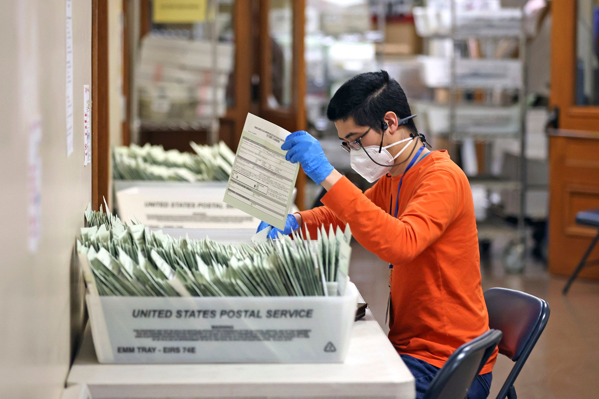 Voter records clerk Andrew Chen sorts ballots at the San Francisco Department of Elections in San Francisco City Hall on Wednesday, Nov. 6.