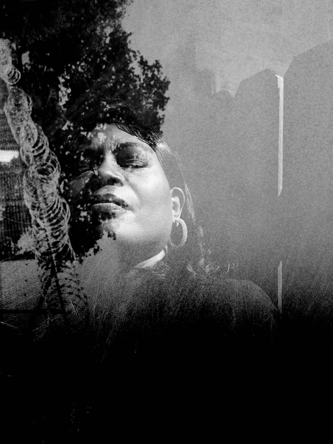 A black and white photo composite shows a photo of a Black woman with hoop earrings and medium-length hair with her eyes closed, standing in front of a fence. To her left, in what looks like a double exposure effect, a photo of barbed wire fencing and trees are visible. 