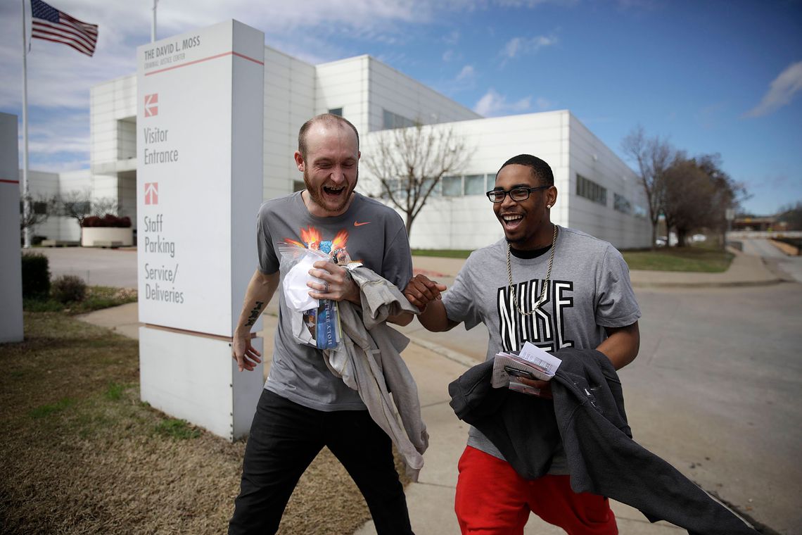 Gary Poindexter, left, and Christopher Brown leave the Tulsa County Jail after being released on Thursday. Due to the COVID-19 outbreak, a special docket was created to expedite release of those locked up on low level offenses.
