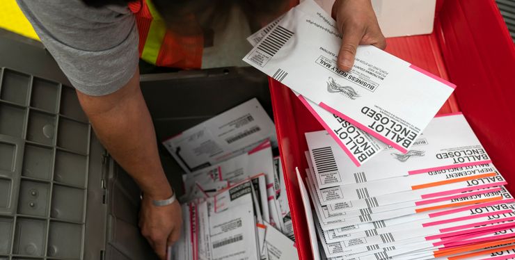 An election worker sorted submitted ballots at the Multnomah County, Oregon, elections office on Nov. 2.