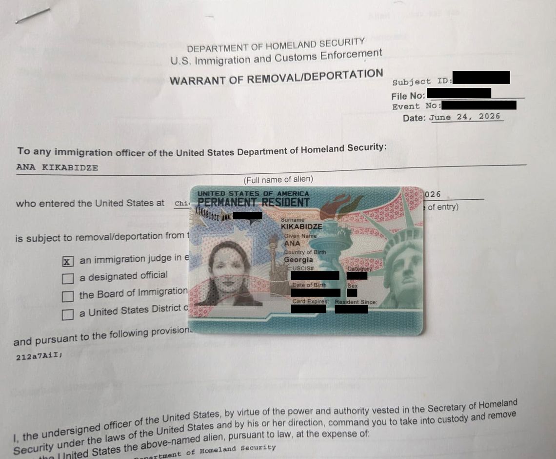 A photo shows a woman’s green card placed on top of a document from the Department of Homeland Security and U.S. Immigration and Customs Enforcement, titled “Warrant of Removal/Deportation.” 