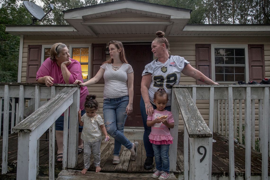 Adams, her birth daughters Kristina and Ashley, and their children at Adams's home in Apex, N.C.