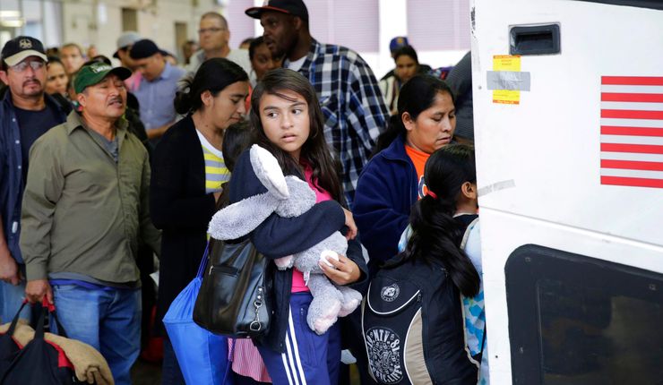 Immigrants from El Salvador and Guatemala board a bus after being released from a family detention center in Texas. 