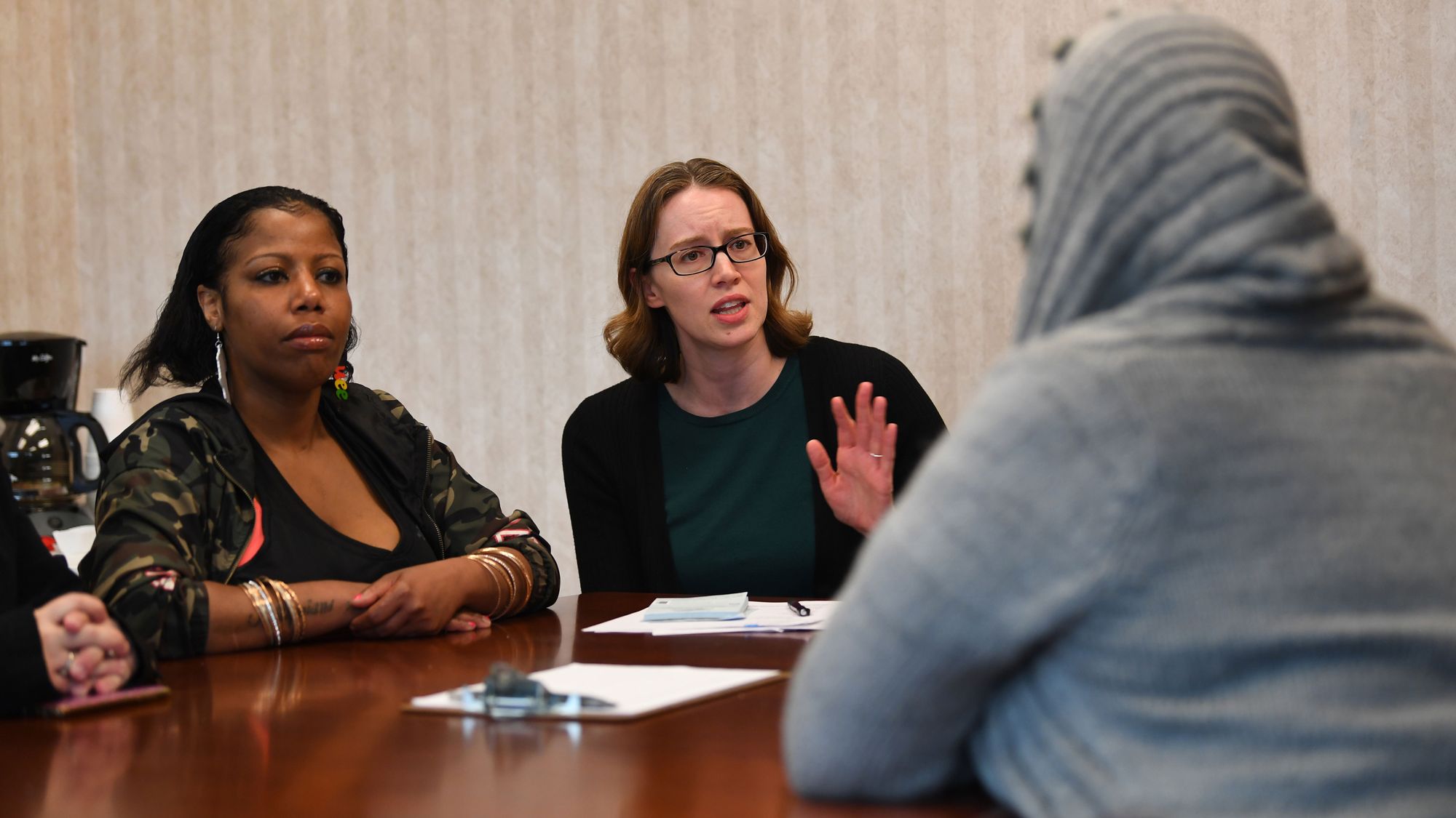 Dr. Erin Zerbo, center, who runs the Newark, N.J., CARE Center (Center for Addiction Resources & Education), talks with a group of patients, including Cydiaa Williams, at left. 