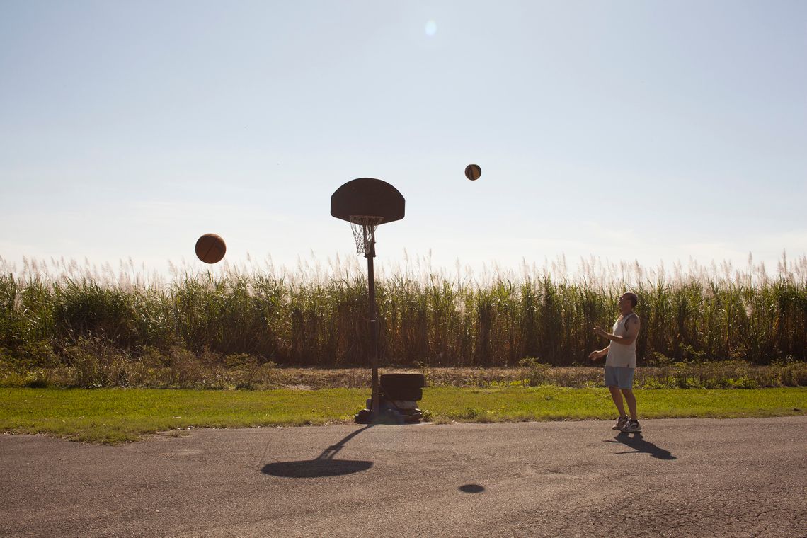 Richard playing basketball. “Living in Miracle Village is quiet, peaceful, yet isolated. When people call me about jobs, they never know where Pahokee is.”