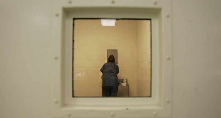 A woman diagnosed with bipolar disorder sings “Mary Had a Little Lamb” to herself in her cell in the women’s acute mental health unit of the Bexar County Jail in San Antonio.