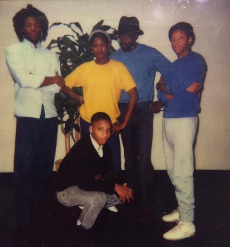 An undated photo taken during a prison visit. Moochie (left) with brothers Willie (front) and Douglas (right), cousin Sharon Reid, and an unidentified friend.