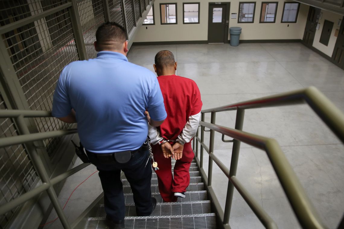 A guard escorting an immigrant detained at the Adelanto Detention Facility in Adelanto, Calif. on Nov. 15, 2013. 
