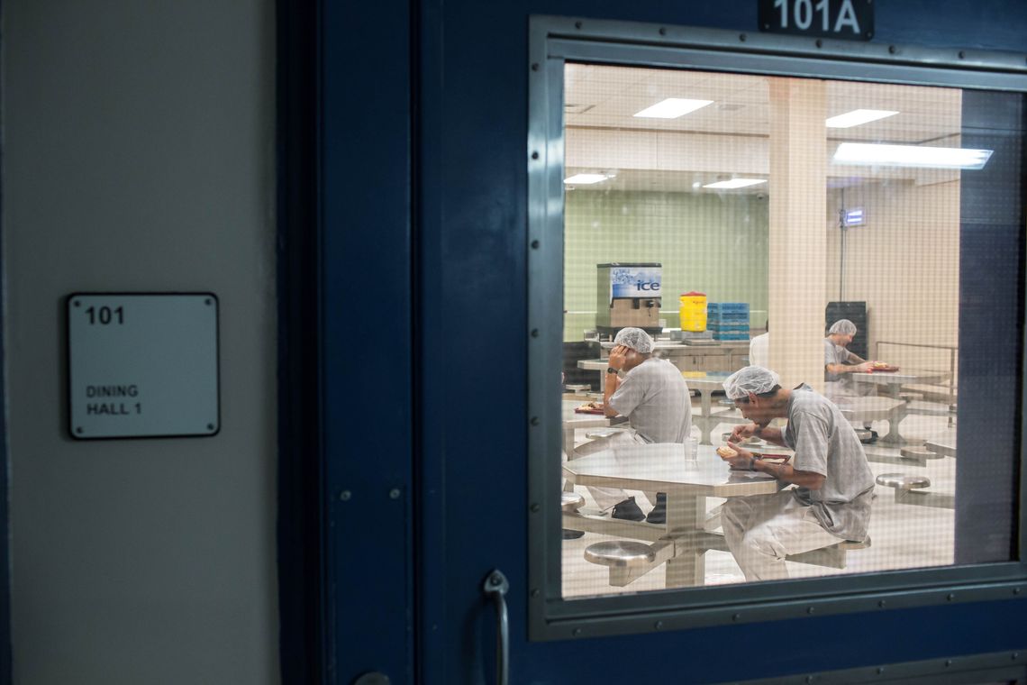 Inmates eat at a cafeteria in Central Prison.