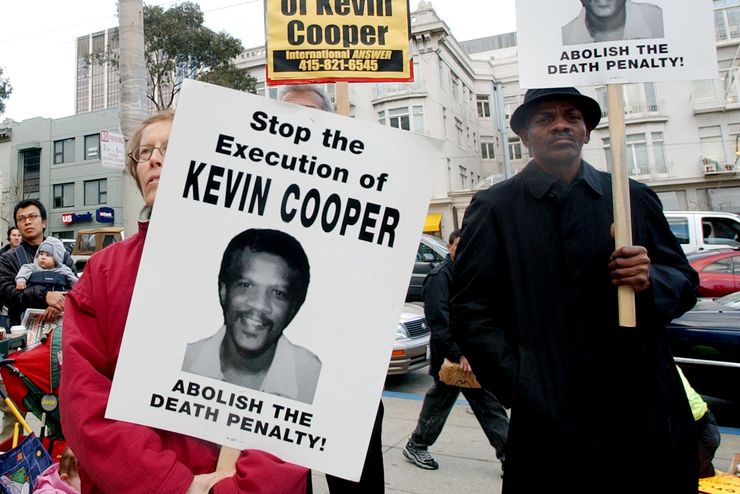 Protesters attend a rally in downtown San Francisco, Tuesday, Feb. 3, 2004, to denounce the Feb. 10 execution of Kevin Cooper at San Quentin State Penitentiary. Cooper was convicted of murdering two children and two adults in a Chino Hills home shortly after escaping from the California Institution for Men in nearby Chino in 1983. (AP Photo/Marcio Jose Sanchez)