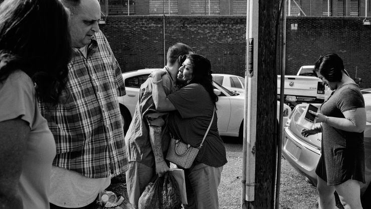 A woman embraces a relative as he was released from prison at the Huntsville Unit in Texas.