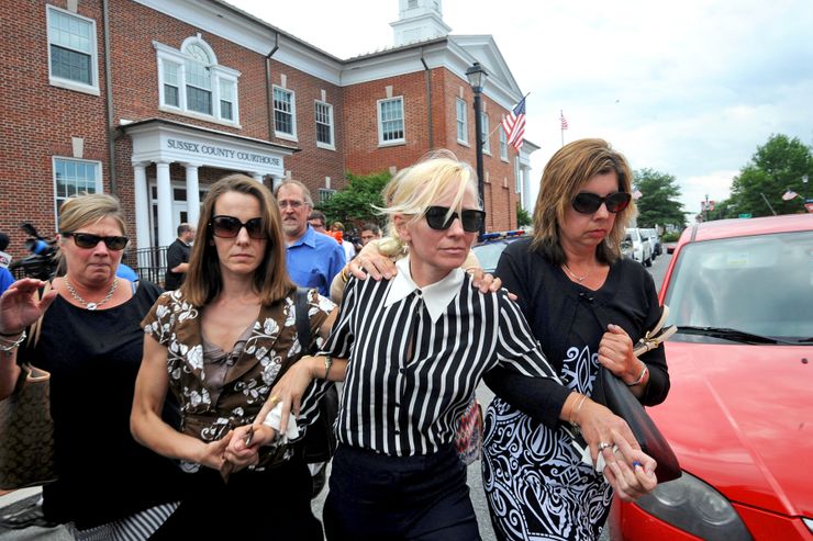 Molly Shattuck, center in striped shirt, leaves the Sussex County Courthouse in Georgetown, Del., in June, after pleading guilty to raping a 15-year-old boy.