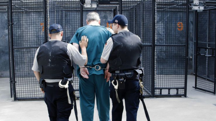 An inmate is led to recreational cages in Kristi Jacobson’s “Solitary: Inside Red Onion State Prison.”