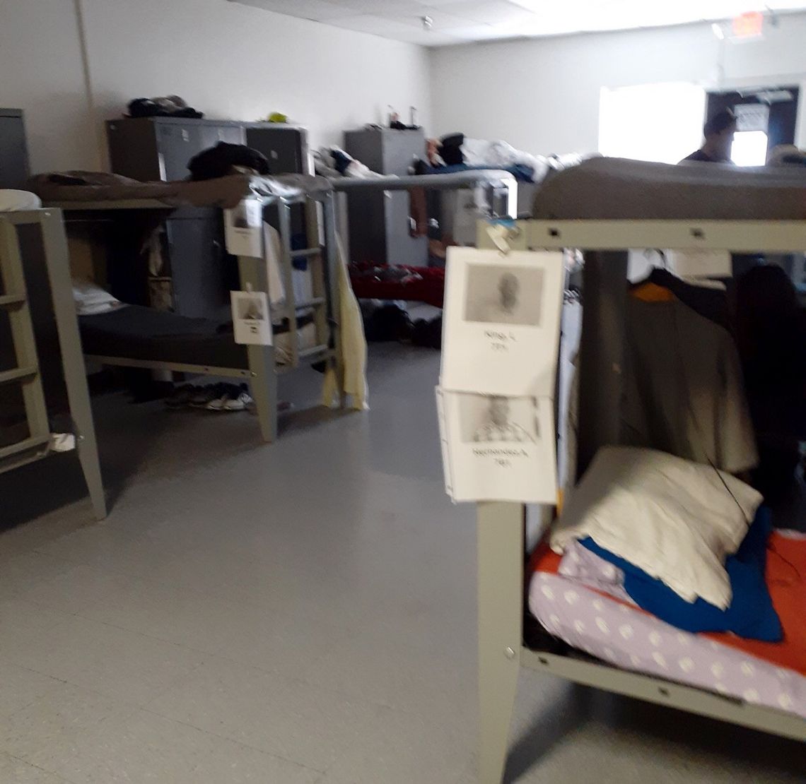 Residents sleep in double-bunks spaced a few feet apart in Orion House, where social distancing is virtually impossible.