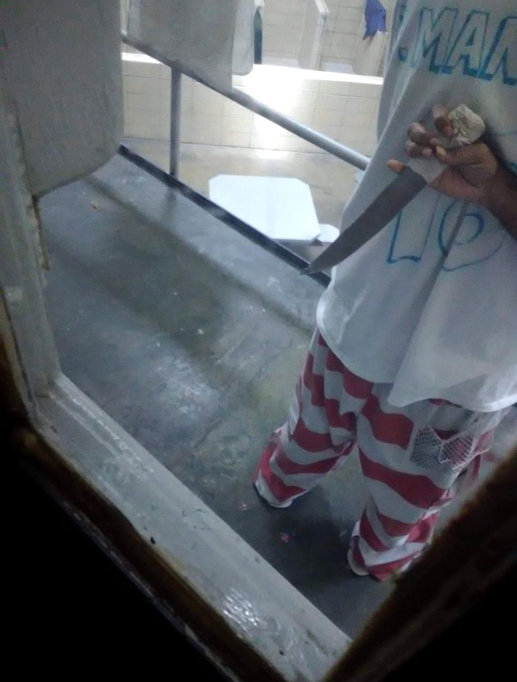 This image of a prisoner holding a shank inside Wilkinson County Correctional Facility in Mississippi was sent to The Marshall Project in late May by an inmate with a contraband cell phone. 
