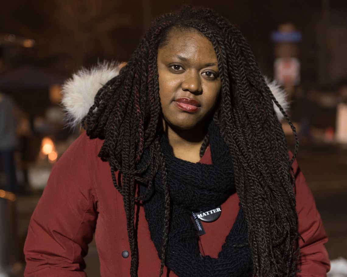 EXHAUSTED: Yolanda Hare, 32, who lives in the neighborhood and is a special-education teacher in a K-8 charter school, had started her day of protest nearly 12 hours earlier, with a 9 a.m. sit-in at City Hall. She says her employer has been flexible and supportive of her activism.
