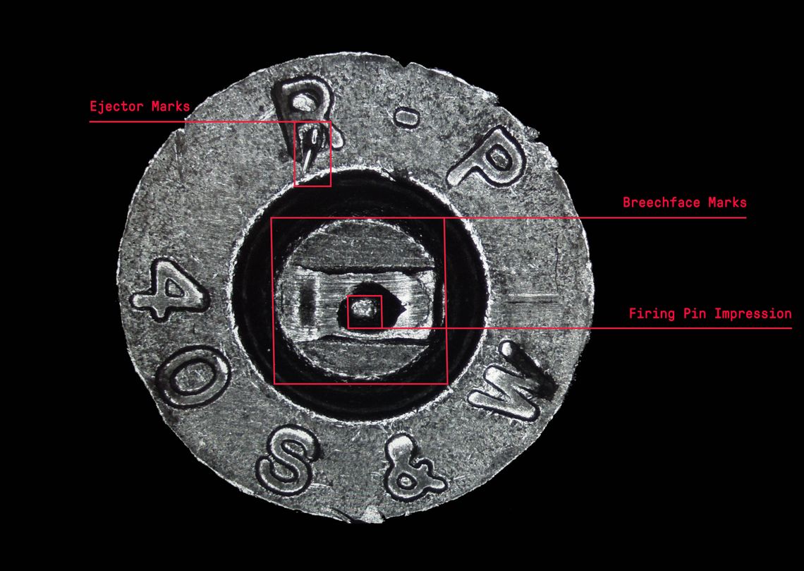 A magnified view of the firing pin impression, ejector marks and breechface marks that are used by technicians to match different cartridge cases.