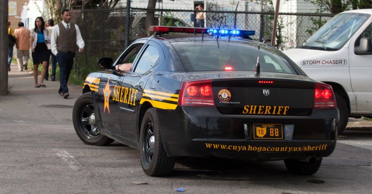 A black and yellow sheriff's vehicle on a street in Cleveland. 