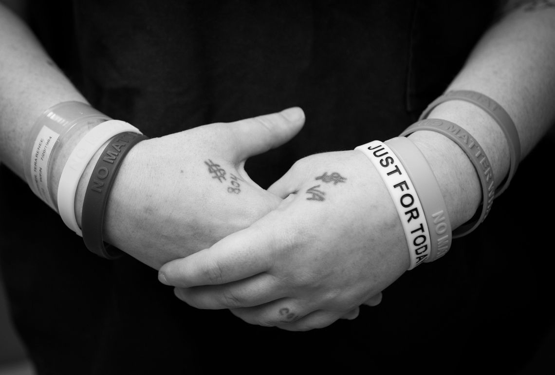 Tera Crowder, 34, shows her bracelets, each marking another month of clean time. She has sought recovery from addiction before, but she thinks something is different about the peer-to-peer HARP program. "We're already beat down enough. That's what's different about this program. [It] teaches you the tools to staying clean," she said.