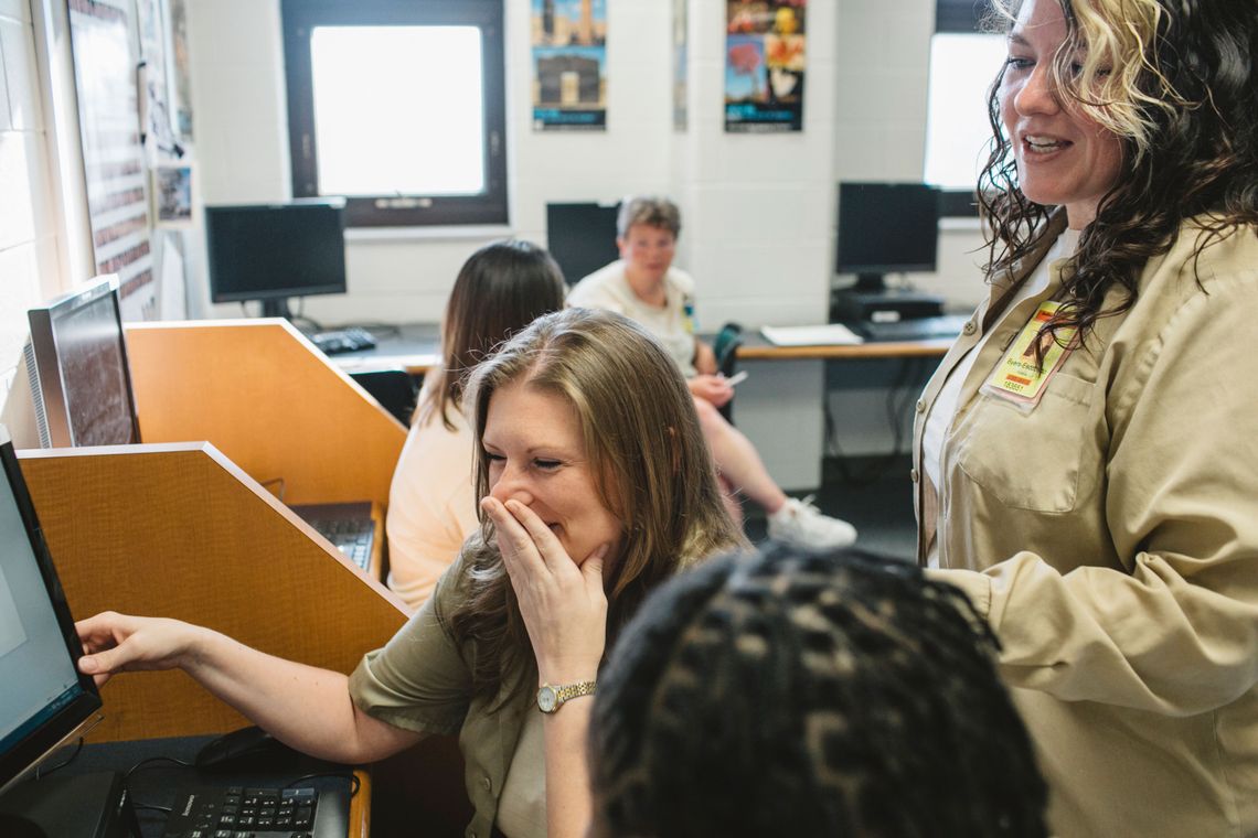 Sarah Jo Pender, left, works with Kristina Byers-Escobedo, right, in a class at the Indiana Women's Prison. 