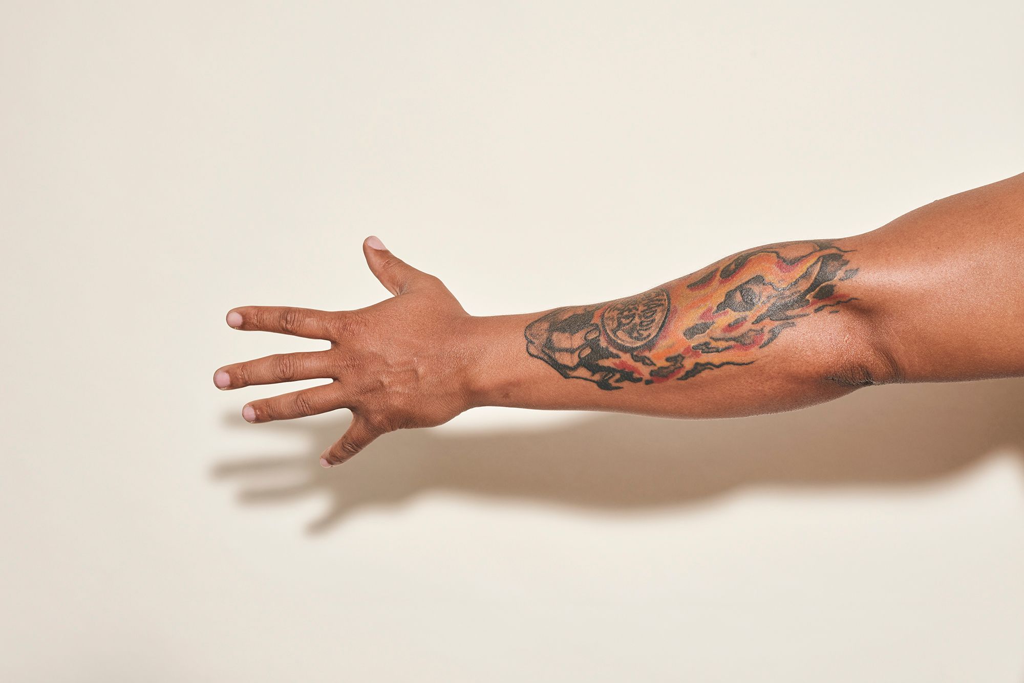 The tattoo on King’s left arm shows a hand holding a crystal ball saying “Shadow Bred,” because during his time in prison, he wanted to be in the shadows and not draw attention to himself. 