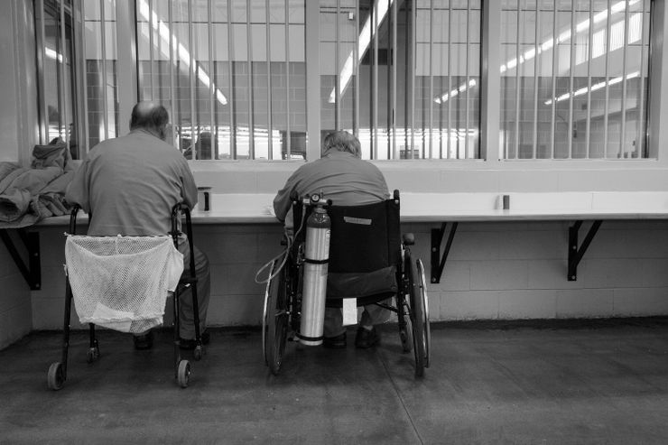 Aging inmates eat lunch in the dining hall at Devens federal prison in Massachusetts in 2015.