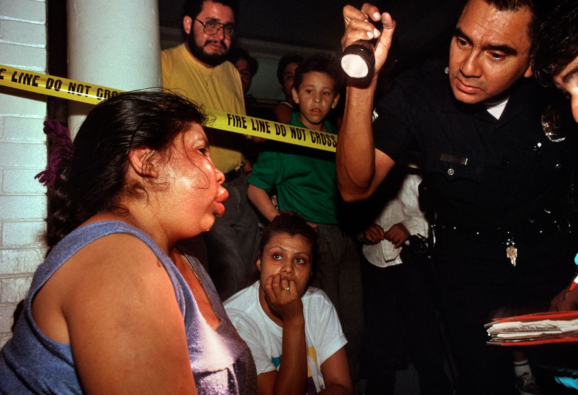 An LAPD officer responds to a domestic violence call in Los Angeles in September 1994.
