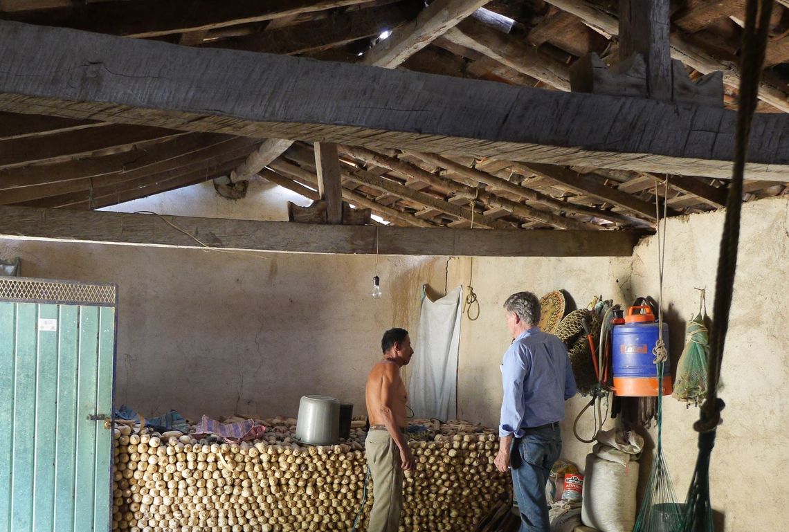 Anthropologist Charlie Goff, right, speaks with Angel Campos Nava's uncle Luis Nava Carreto in the house where Nava lived as a small child. With Goff's guidance, Nava's court-appointed attorney visited the village of El Terrero in southern Mexico to prepare his defense.