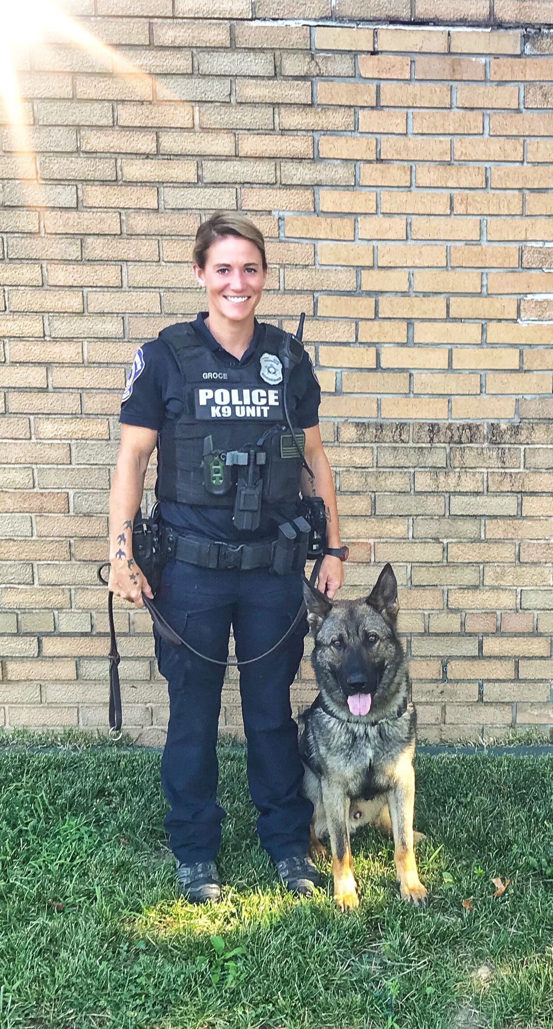 IMPD Officer Molly Groce poses with her second K-9 partner, who she calls Lando, in a 2019 photo shared by the police department.