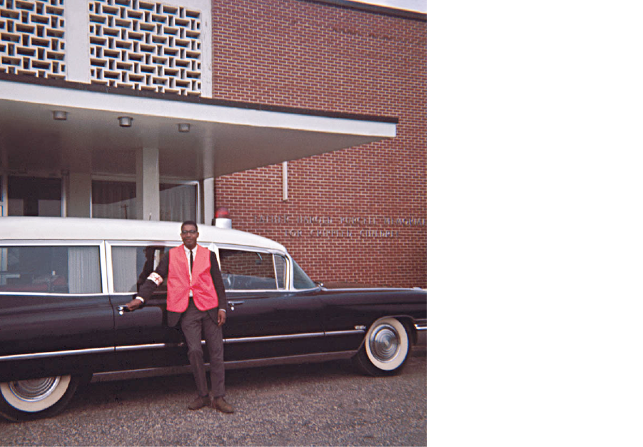 Dr. Alvin Poussaint, a leader in the health care civil rights movement, with an “ambulance” during the 1965 march from Selma to Montgomery, Ala. Since White hospitals frequently refused to send ambulances for Black patients, Black medical workers repurposed hearses for medical transport. Patients sometimes died in the hearse as the driver searched for a hospital willing to accept a Black person.