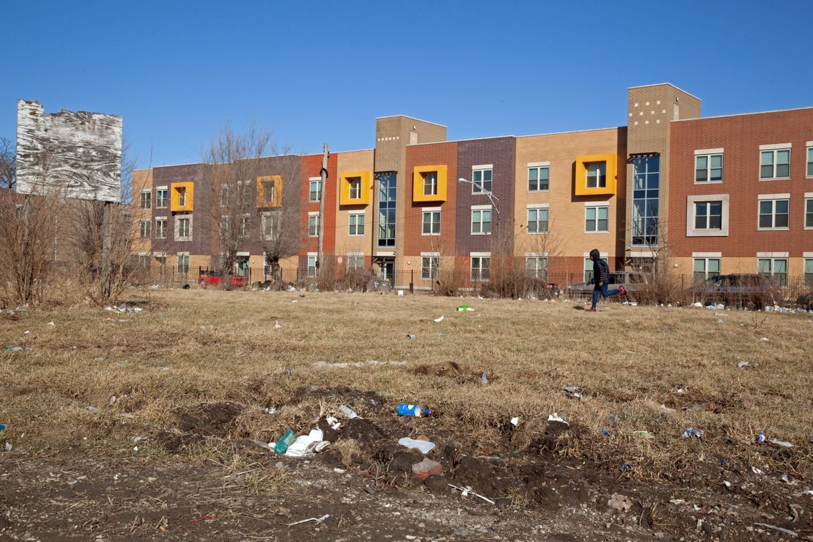 A child runs through an empty lot behind the Dr. King Legacy Apartments in the North Lawndale neighborhood of Chicago in February. 