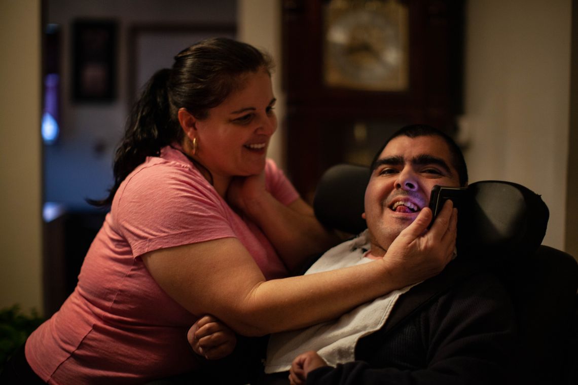 Juan is cheered by hearing Pedro over the mobile phone before he goes to a workshop at an adult day care center in October 2019. With the coronavirus, since March Juan cannot leave the house.