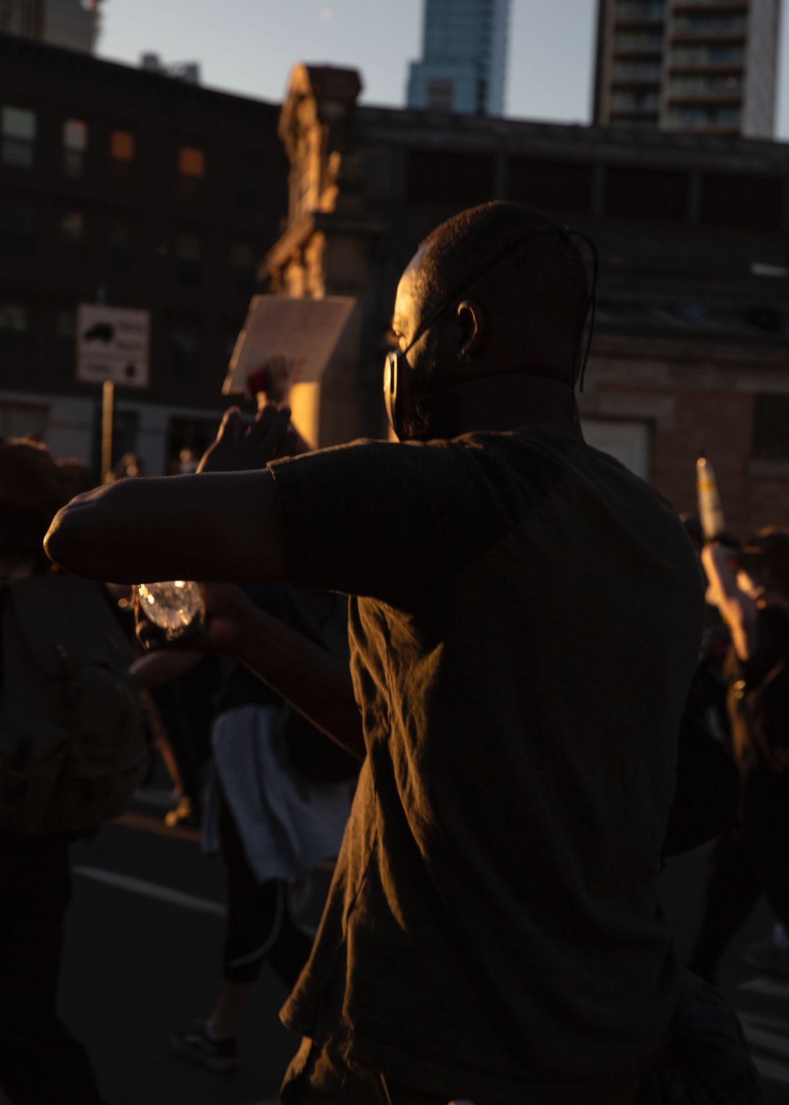 A protester makes his way toward the Manhattan Bridge from the Barclays Center in Brooklyn on Sunday, during protests that brought thousands to the streets. 
