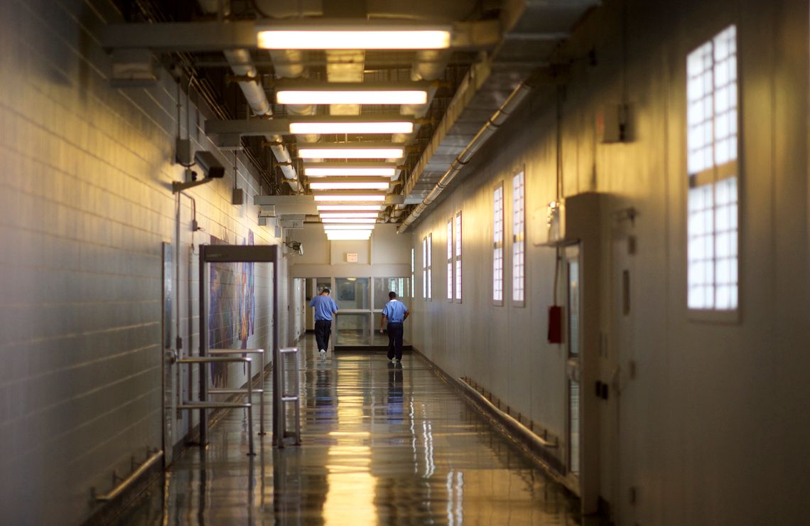 Inmates walk the hallways of the Curran-Fromhold Correctional Facility in Philadelphia, Pa.