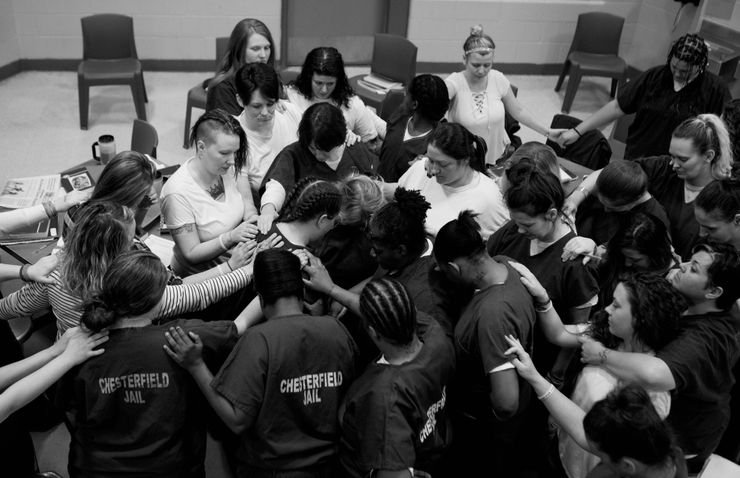 HARP members prayed for a participant as she was released from jail in November of 2017.
