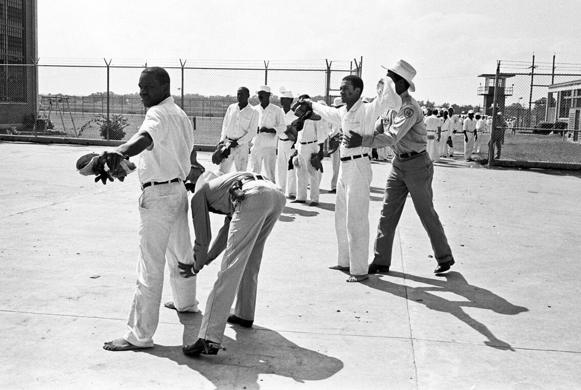 Correctional officers searched prisoners at the Darrington Unit in Rosharon, Texas, after they returned from working in the fields, in 1978. The unit was named after slaveholder John Darrington, who once owned a plantation on that same land.