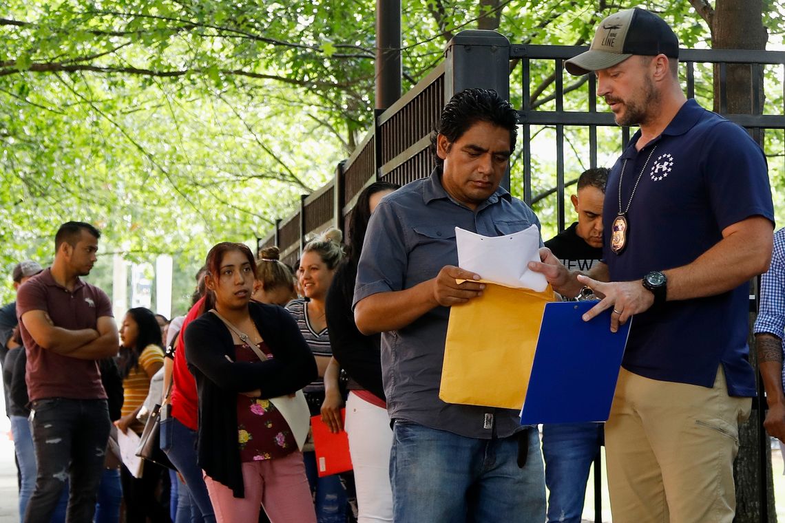 People lined up outside the building that houses Immigration and Customs Enforcement and the immigration court in Atlanta in June. 