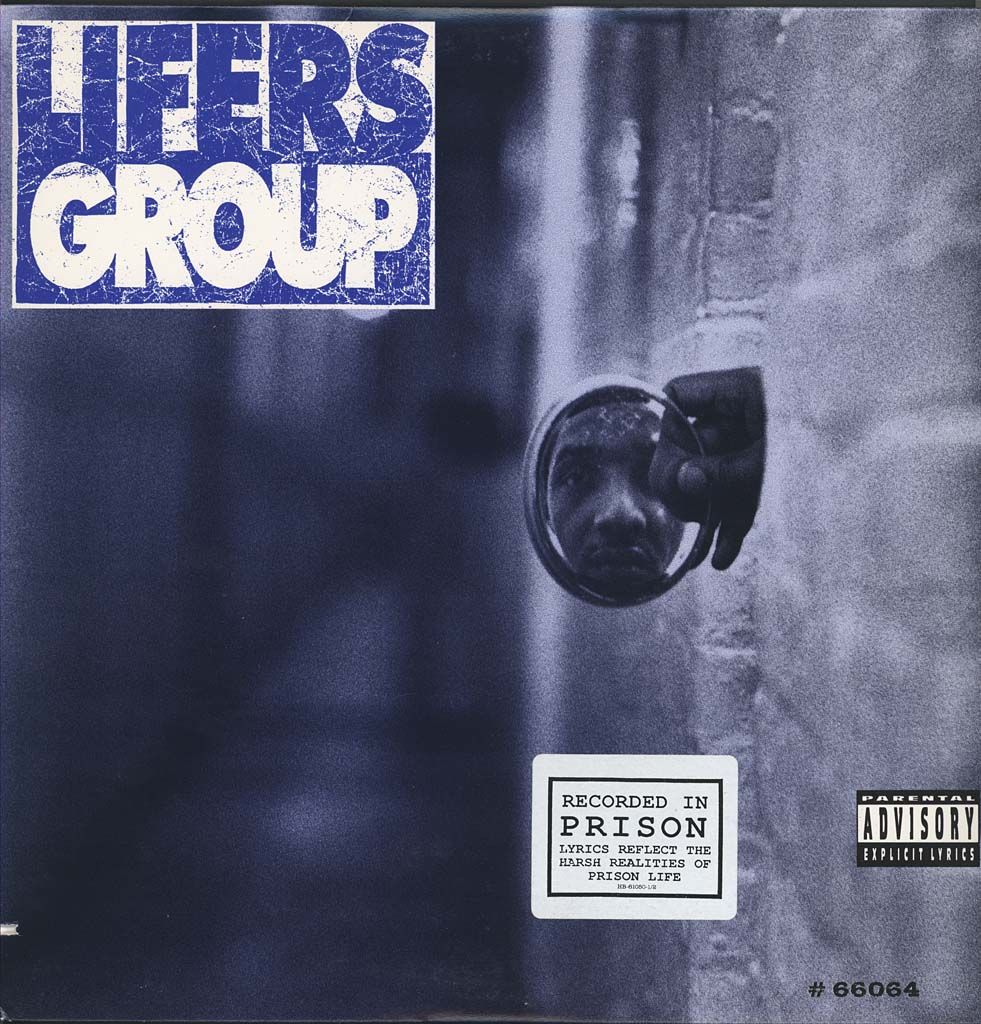 A photo of an album cover shows a hand in the center holding a small circular mirror with a Black man's face reflected in it. At the top right are the words "Lifers Group," and at the bottom right are the words "Recorded in Prison, lyrics reflect the harsh realities of prison life." There is also a parental advisory label on the album. 